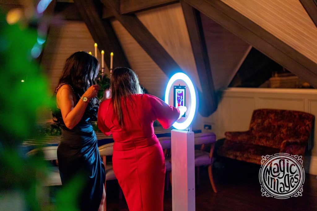 Digital photo booth being used by two guests at a wedding